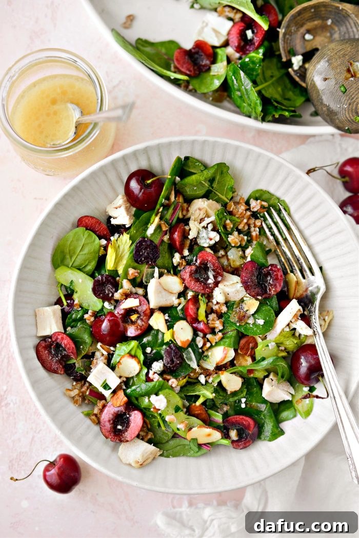 A large portion of Cherry Winter Wheat Berry Salad served on a rustic wooden board, emphasizing its abundance and inviting appeal