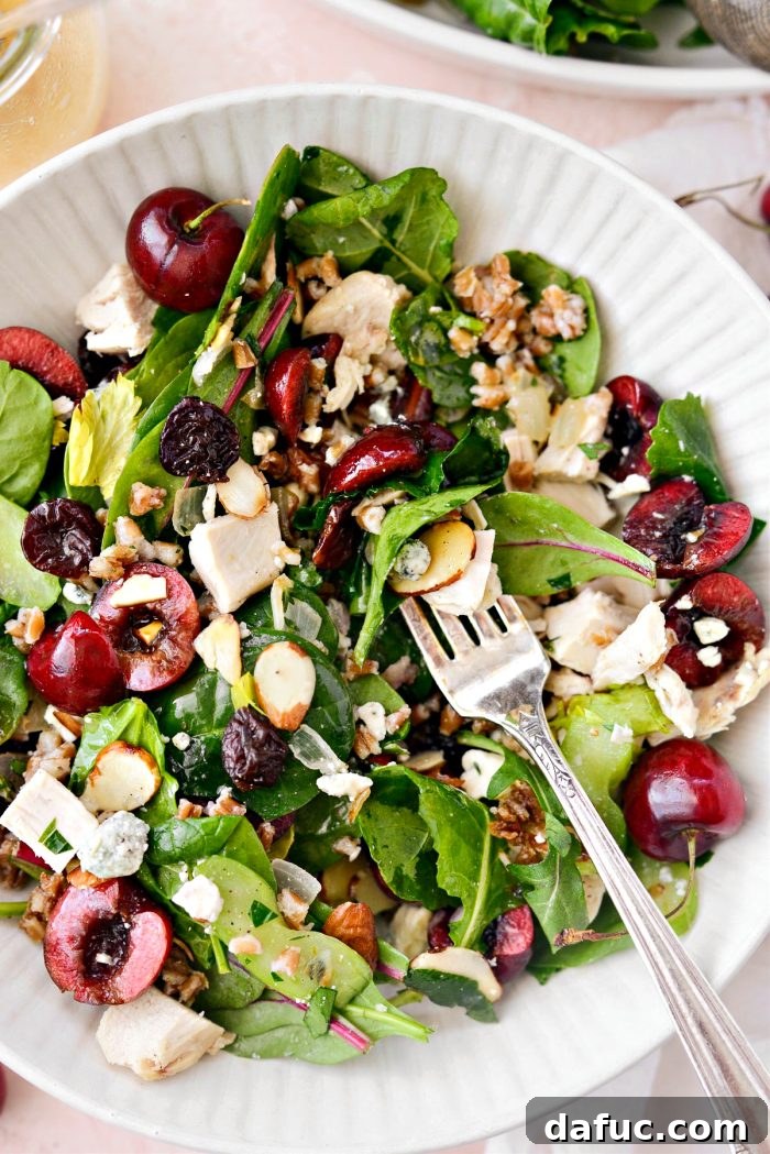 Another close-up shot of the Cherry Winter Wheat Berry Salad, highlighting the fresh cherries and blue cheese