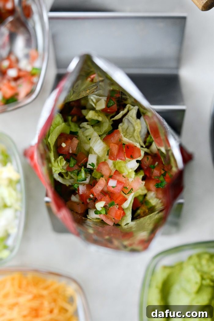 Walking Tacos Two Ways 12 Shredded lettuce and pico de gallo added to the walking taco bag.