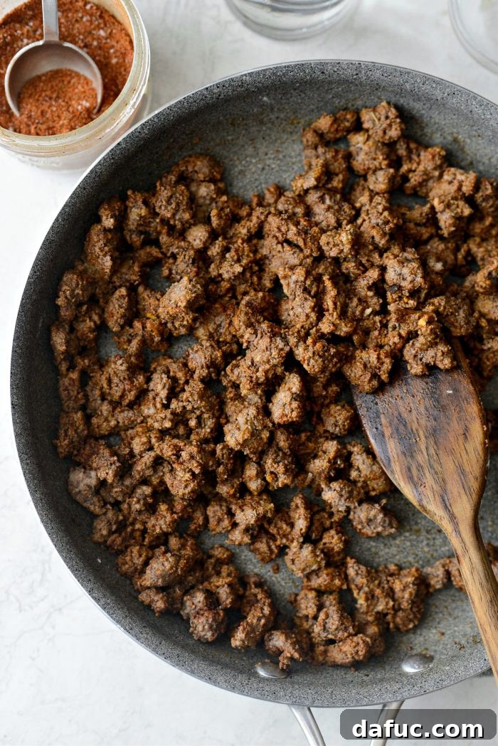 Walking Tacos Two Ways 7 Ground beef and flour mixture combined in a skillet.