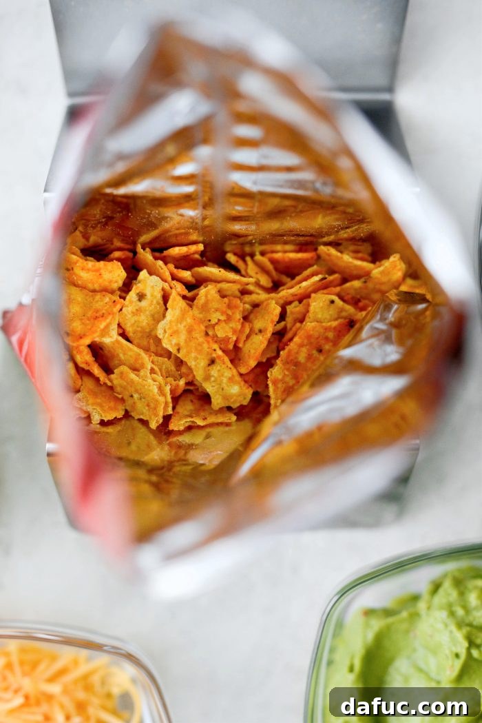 Walking Tacos Two Ways 10 Crushed Doritos in an individual bag, ready for toppings.