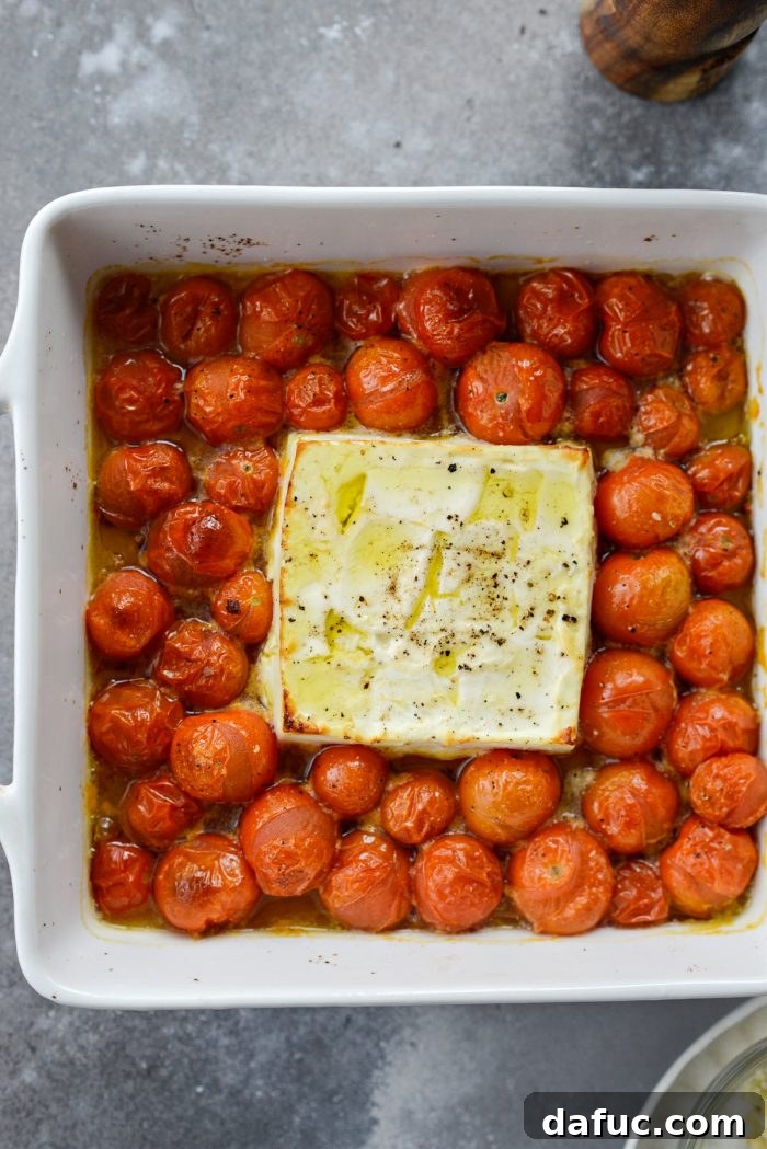 Blistered Tomato Feta Pasta 13 Baked feta cheese and burst cherry tomatoes in a baking dish