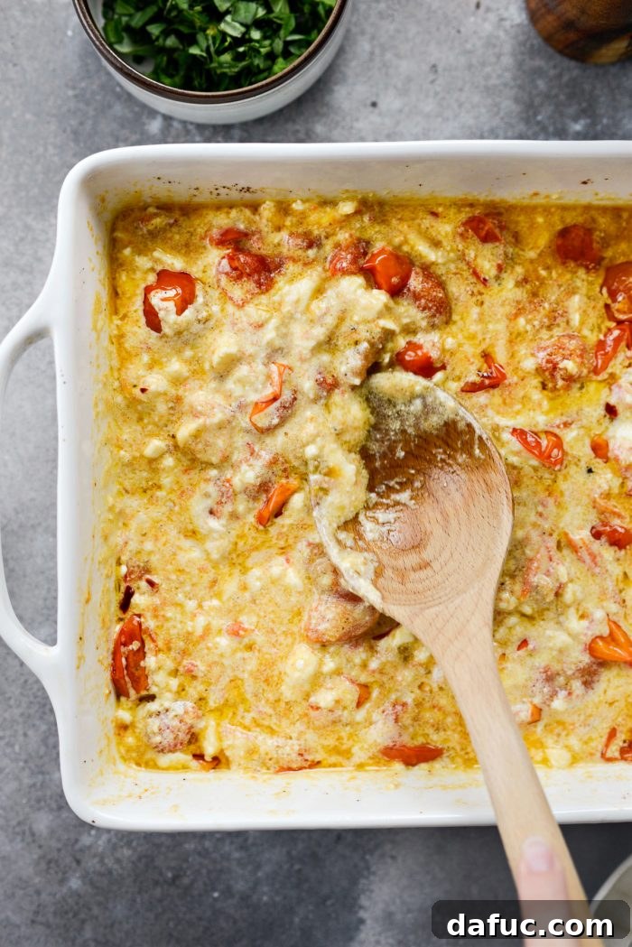 Blistered Tomato Feta Pasta 17 Stirring the baked feta and tomato sauce vigorously