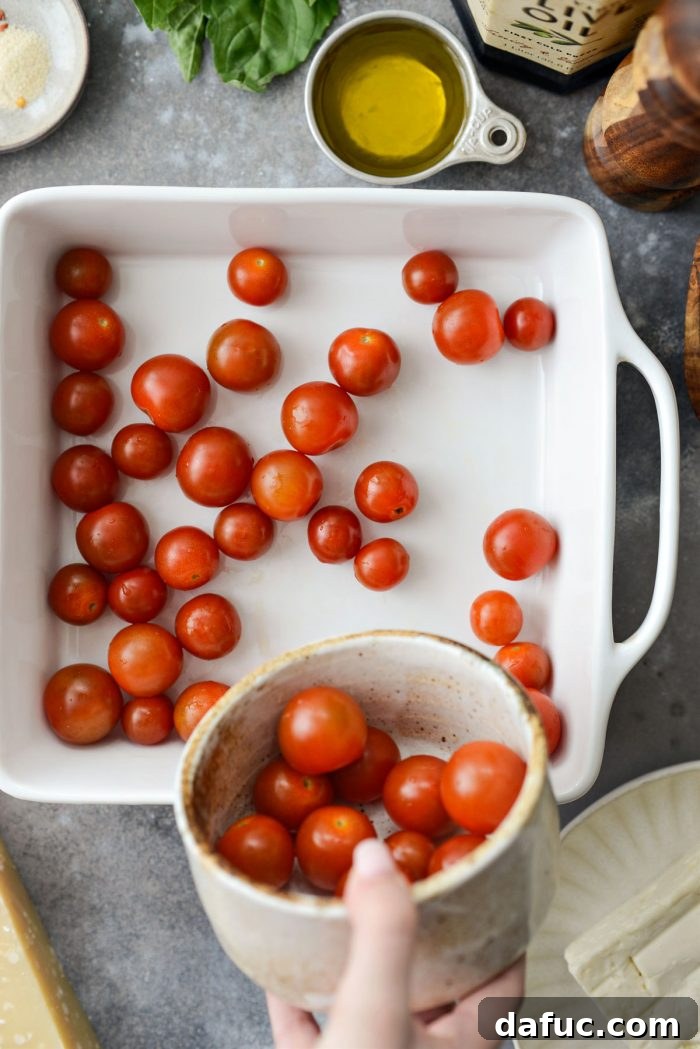 Blistered Tomato Feta Pasta 6 Cherry tomatoes arranged in a baking dish