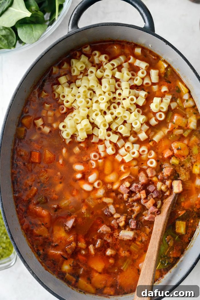 Ina Garten's Cozy Winter Minestrone 14 Pasta, beans, and crispy pancetta added to the pot