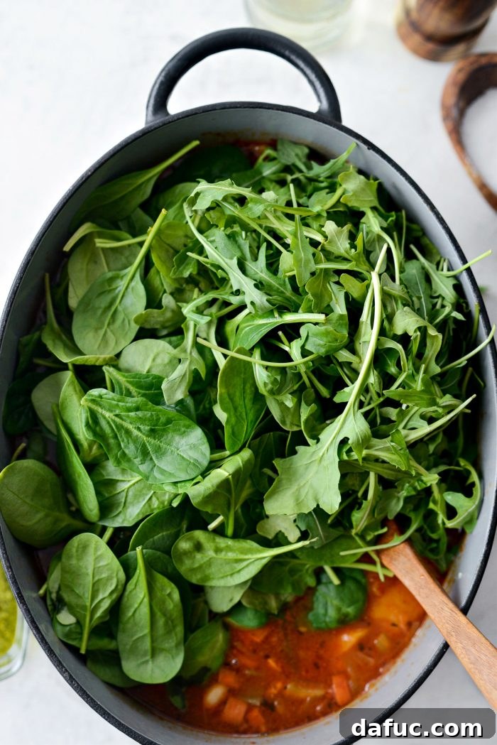 Ina Garten's Cozy Winter Minestrone 15 Spinach and arugula added to the soup