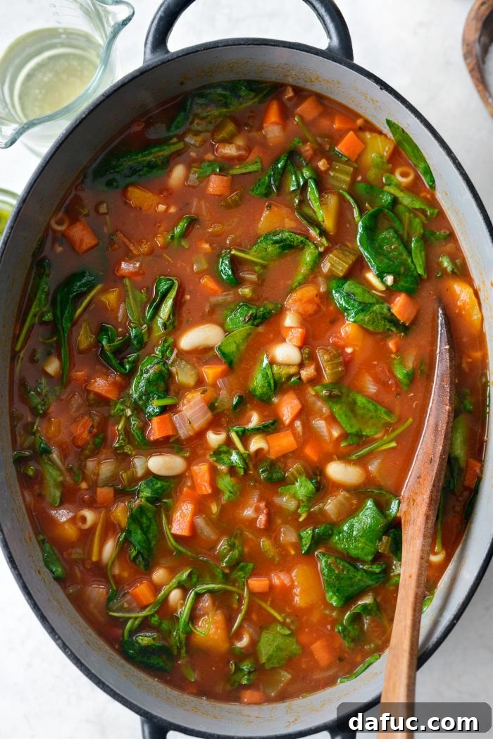 Ina Garten's Cozy Winter Minestrone 16 Wilted spinach and arugula in the soup