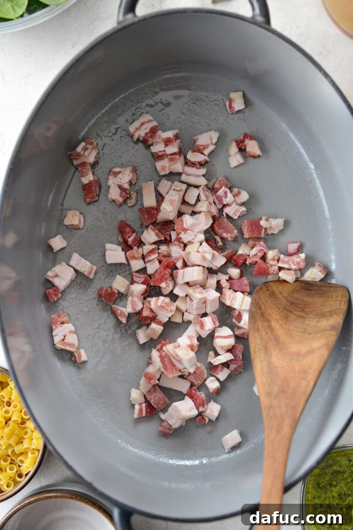 Ina Garten's Cozy Winter Minestrone 5 Diced pancetta cooking in a pot