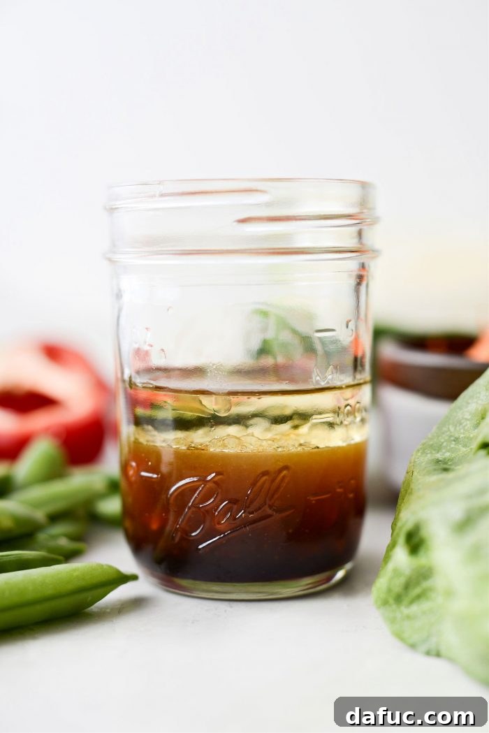 Zesty Thai Cabbage Slaw 5 Homemade Thai Cabbage Salad dressing in a glass jar.