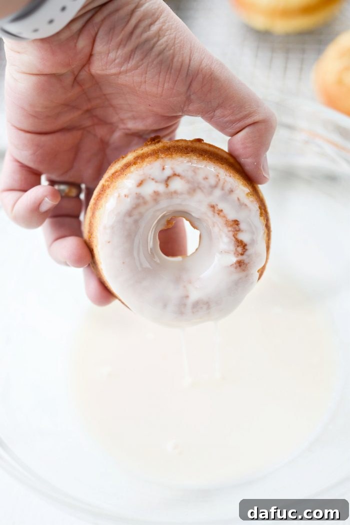 Another view of a Glazed Buttermilk Cake Doughnut, showing the perfectly applied vanilla glaze.
