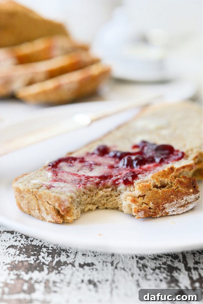 Hearty Irish Hearth Bread 19 A large, rustic loaf of Irish Soda Bread on a wooden board