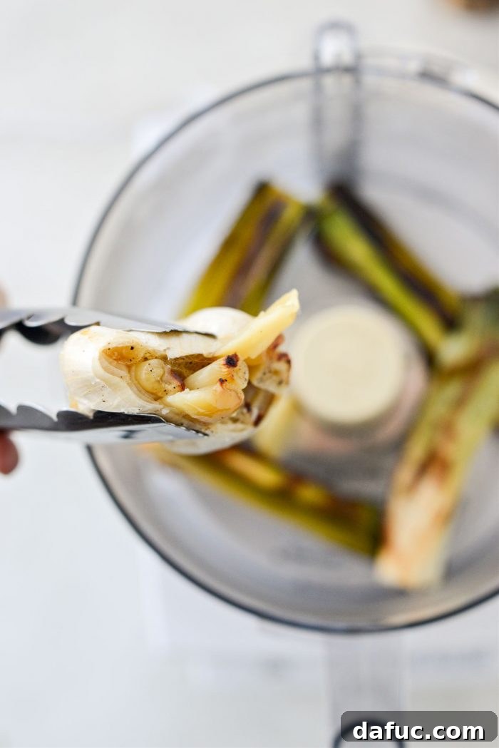 Colcannon Irish Comfort Mash 17 squeeze garlic into food processor with roasted leeks.