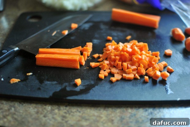 Finely diced carrots on a cutting board
