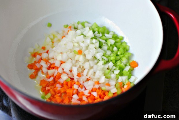Hearty Plant-Based Lentil Stew 18 Adding diced vegetables to hot olive oil