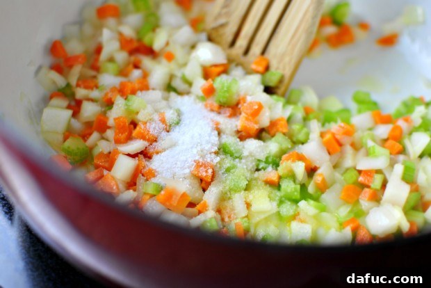 Hearty Plant-Based Lentil Stew 19 Adding kosher salt to sweating vegetables