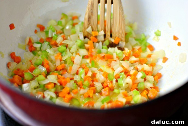 Hearty Plant-Based Lentil Stew 20 Sweated vegetables in a Dutch oven