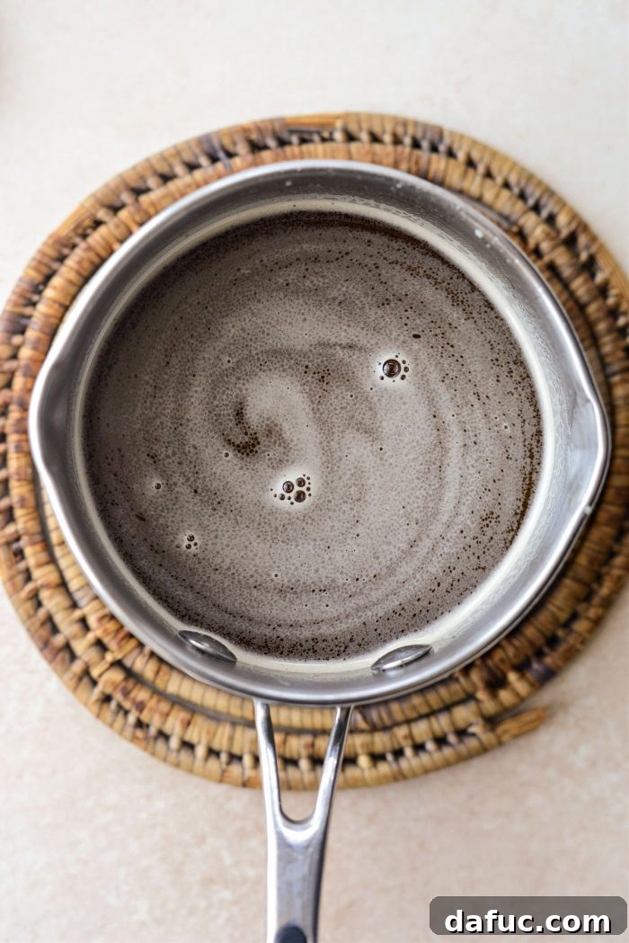 Emerald Isle Whiskey Cake 20 Ingredients for Irish whiskey glaze in a saucepan
