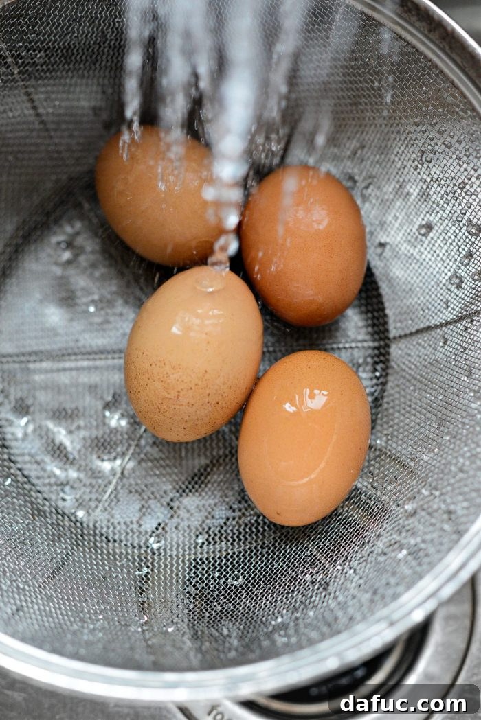 Mastering the Art of Soft Boiled Eggs 7 rinse eggs under cool water