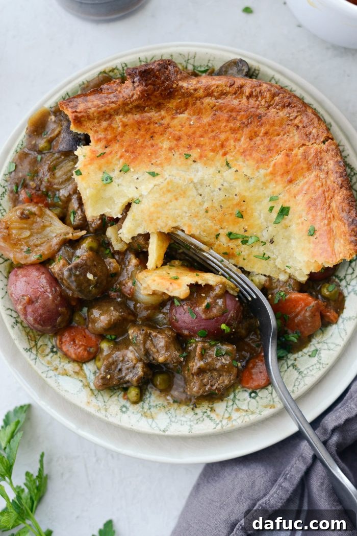 25+ Delicious St. Patrick's Day Recipes 21 Guinness Beef Pot Pie with a flaky Irish Cheddar Crust, served in a cast iron skillet
