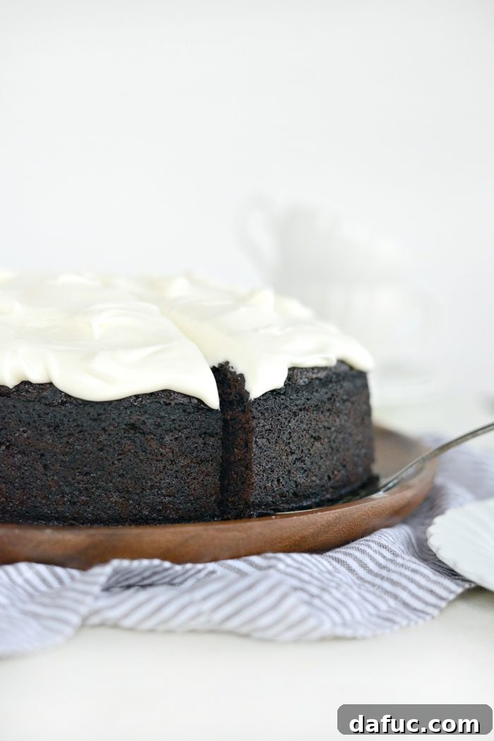 25+ Delicious St. Patrick's Day Recipes 32 Elegant Nigella's Chocolate Guinness Cake with creamy white frosting, sliced