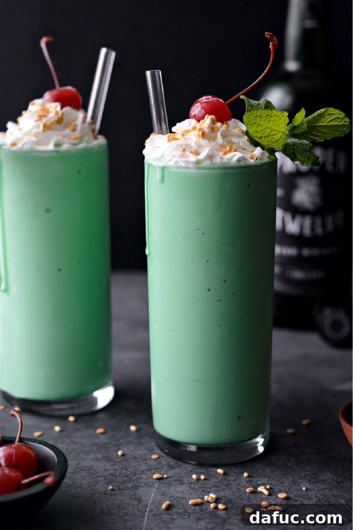 25+ Delicious St. Patrick's Day Recipes 33 Refreshing Boozy Shamrock Shake topped with whipped cream, sprinkles, and a cherry