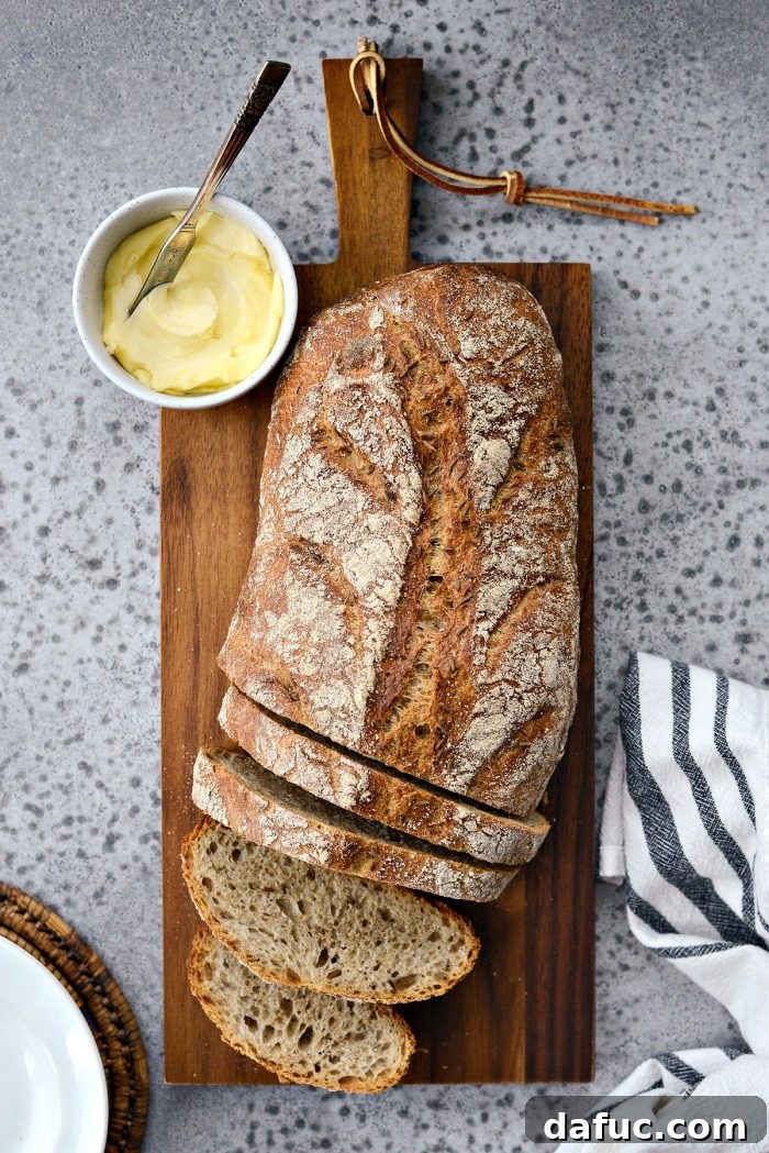 25+ Delicious St. Patrick's Day Recipes 6 Rustic No-Knead Rye Bread loaf with a dark, crusty exterior and dense crumb