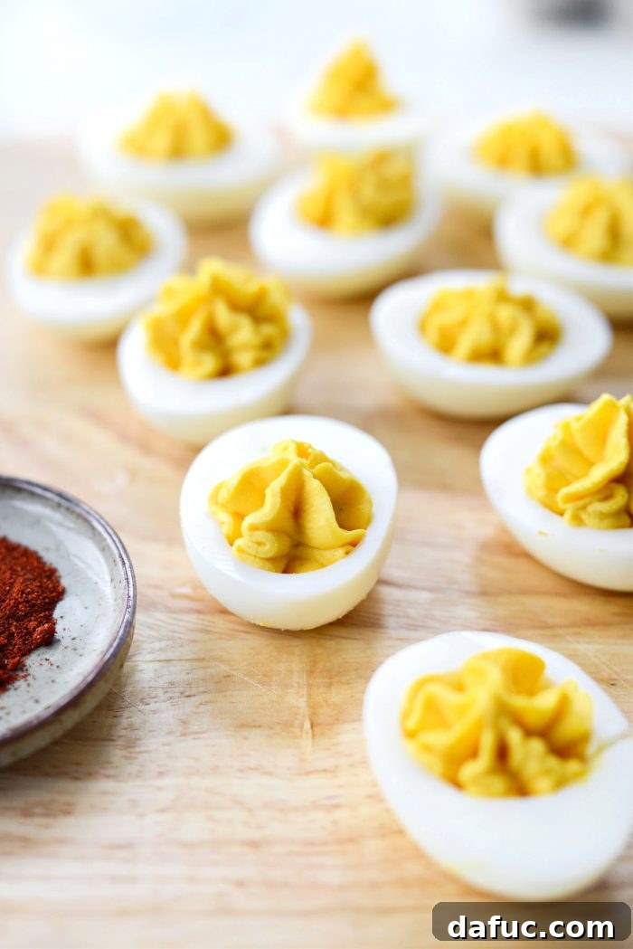 Fill the egg whites with the creamy filling.