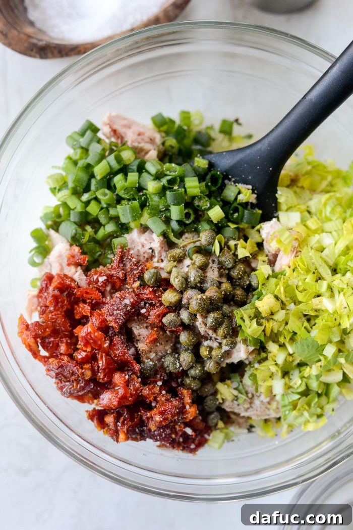 Sun-Kissed Tuna Medley 6 green onion, sun-dried tomatoes, capers and celery with salt and pepper into bowl