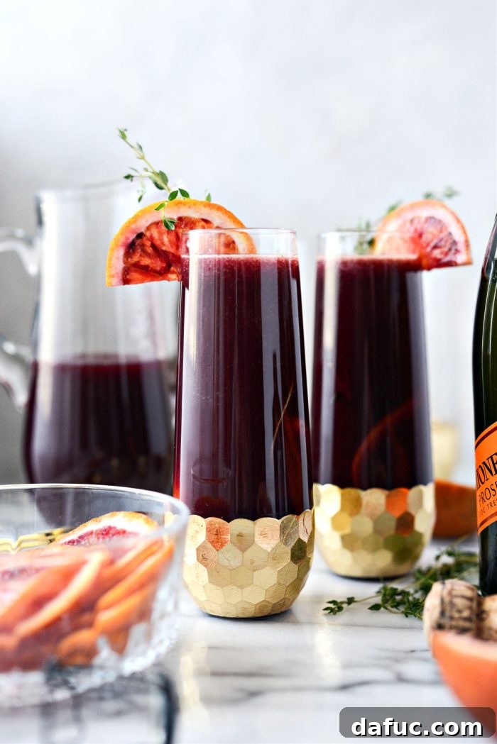 Velvet Vanilla Blood Orange Mimosas 3 Two glasses of Vanilla Blood Orange Mimosas, garnished and ready to serve