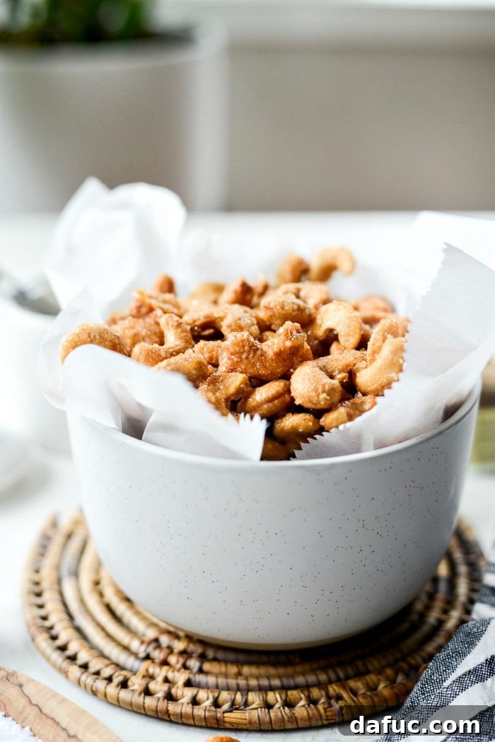 Decadent Honey Roasted Cashews 3 Close-up of freshly roasted cashews glistening with honey glaze, showing their irresistible texture.