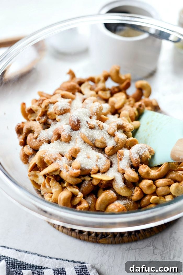 Decadent Honey Roasted Cashews 10 Close-up of roasted cashews immediately after baking, still on the baking sheet.