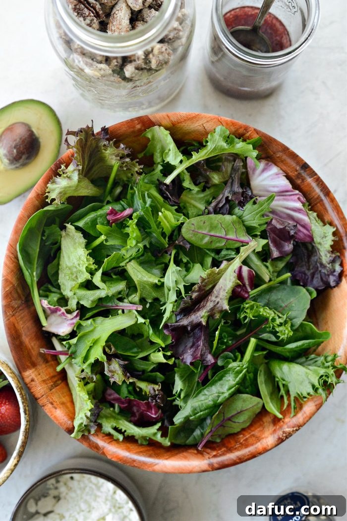 Spring greens being divided into individual bowls