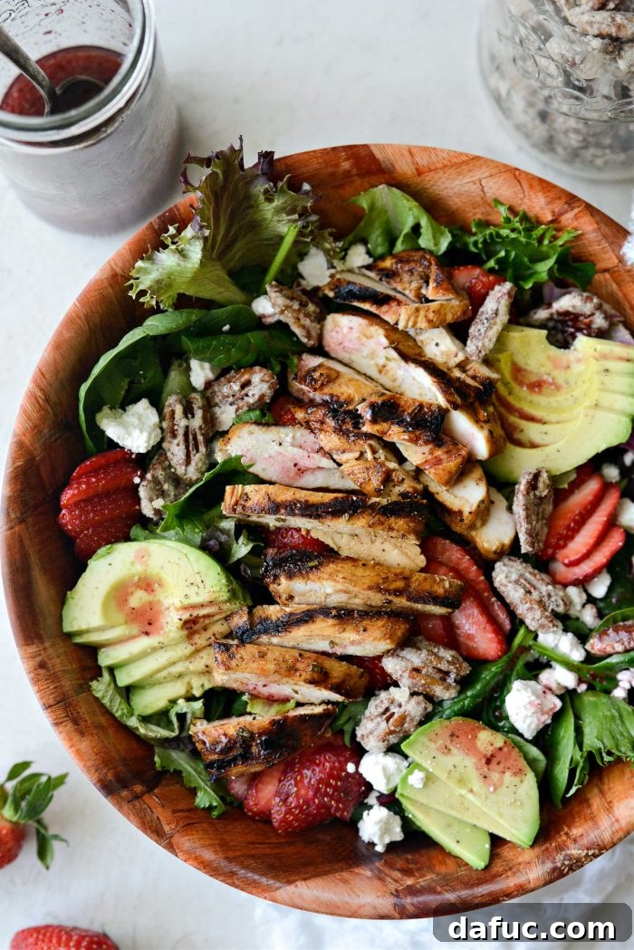 Close up of a fully dressed Strawberry Goat Cheese Spring Salad, ready to be enjoyed