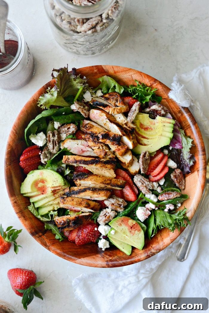 A full view of the Strawberry Goat Cheese Spring Salad in a white bowl