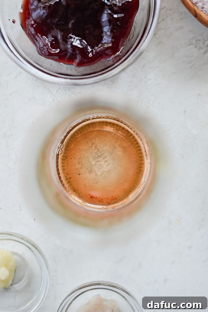 Close-up of salt dissolving in vinegar in a jar