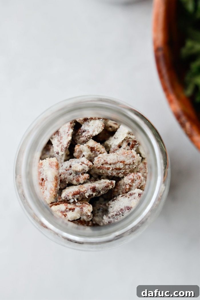 A beautiful close-up of candied walnuts, similar in appearance to candied pecans, in a bowl