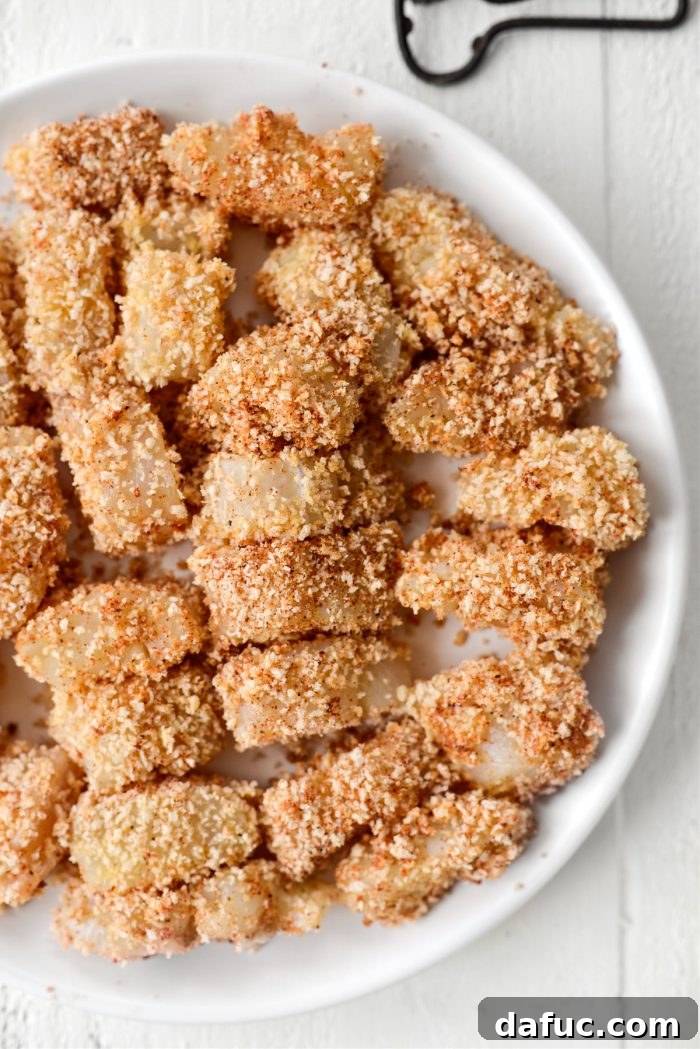 breaded cod on white plate
