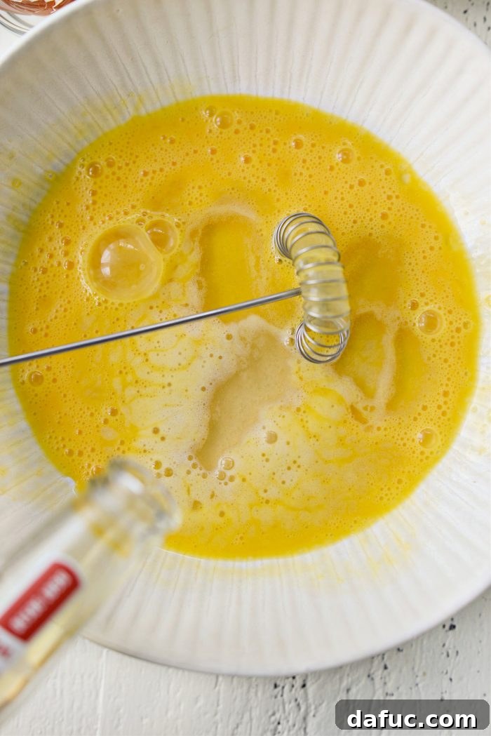 beer pouring into beaten eggs