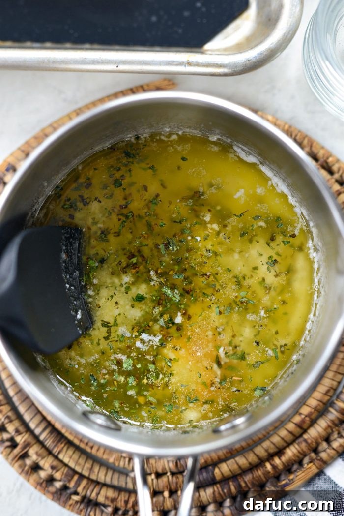 Stirring the garlic herb butter mixture