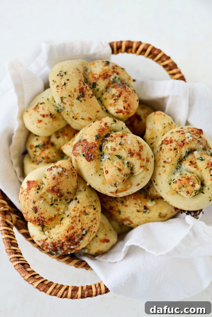 Basket of Easy Homemade Garlic Herb Knots ready to be served