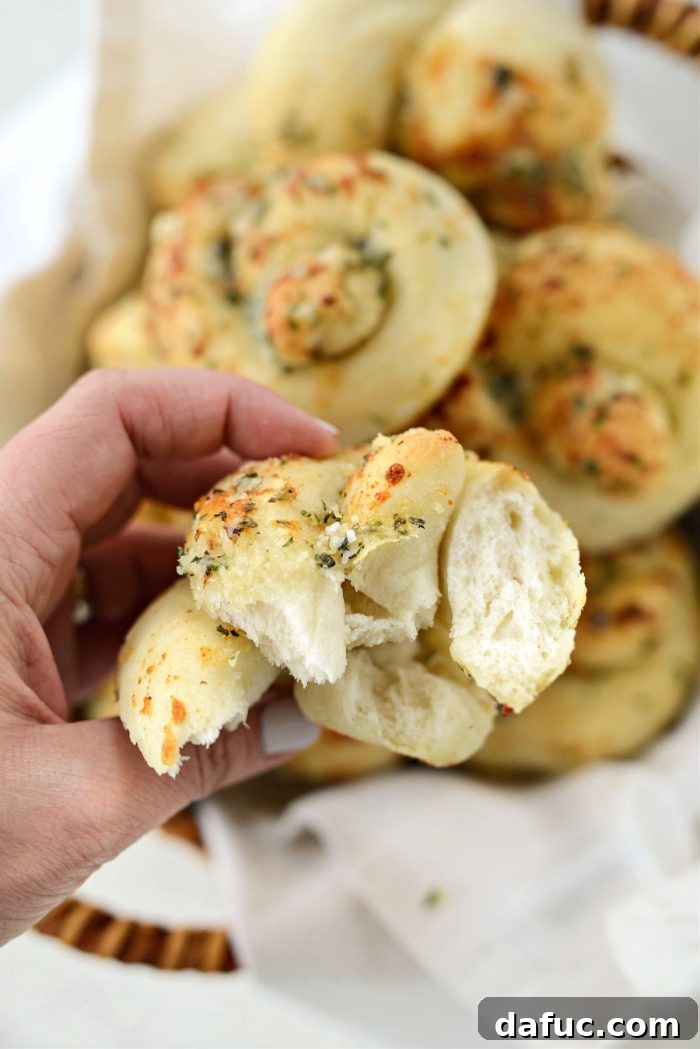 A close-up shot of the interior of a freshly baked garlic herb knot