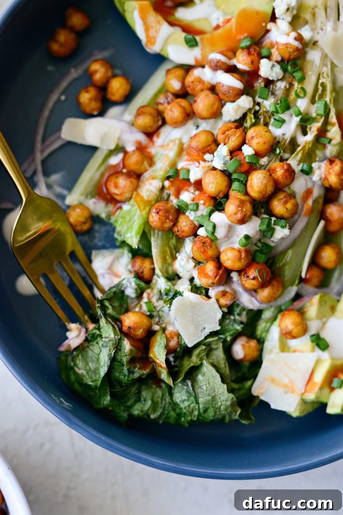 Air Fryer Buffalo Chickpea Caesar Salad - A beautifully styled, finished salad ready for serving.