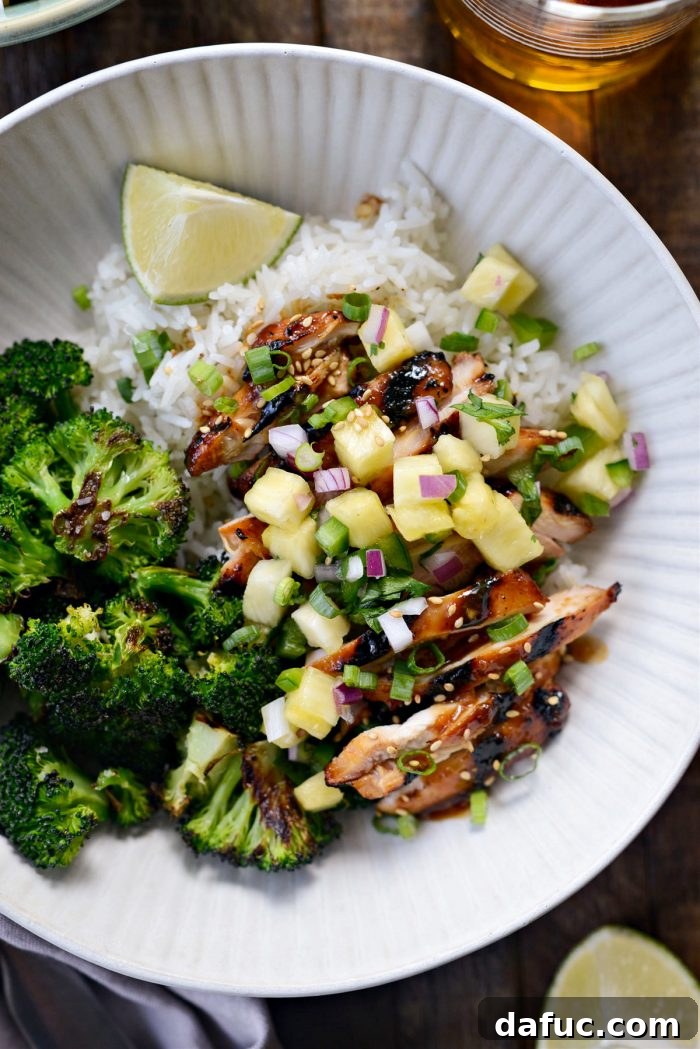 Huli Huli Chicken Rice Bowls - A vibrant dish with grilled chicken, rice, broccoli, and pineapple salsa