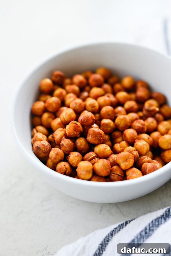 Air Fryer Buffalo Chickpeas in a bowl with a fork, ready to be eaten