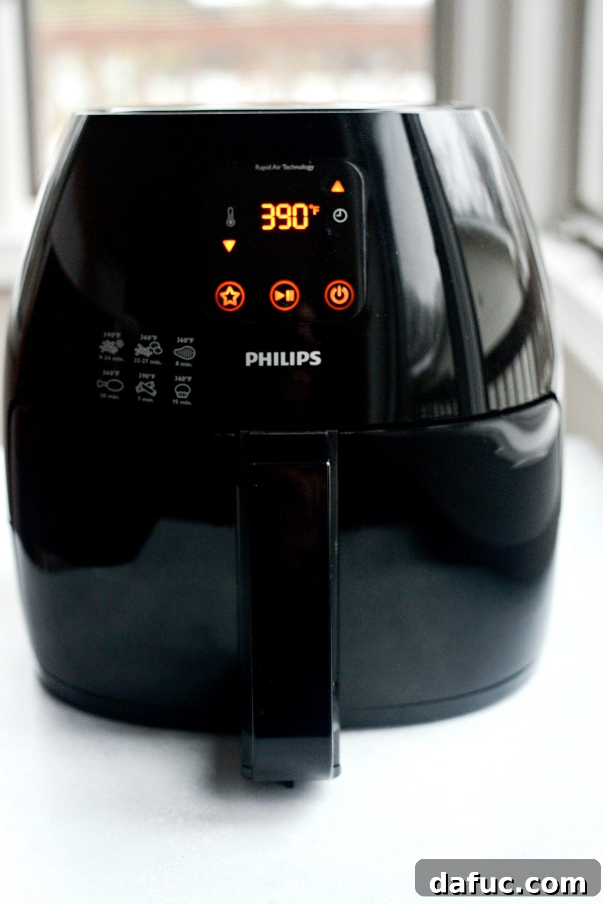 Empty air fryer basket, ready for preheating