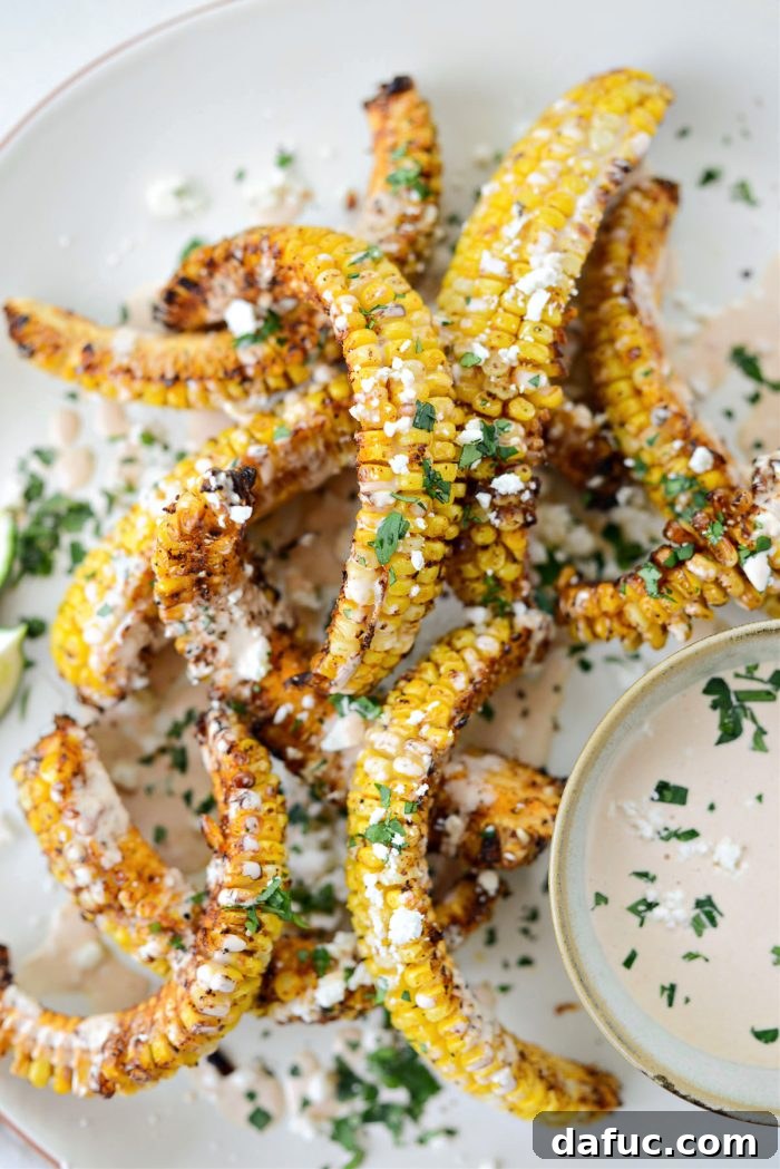 Crispy Air Fryer Corn Ribs served with adobo crema and cilantro