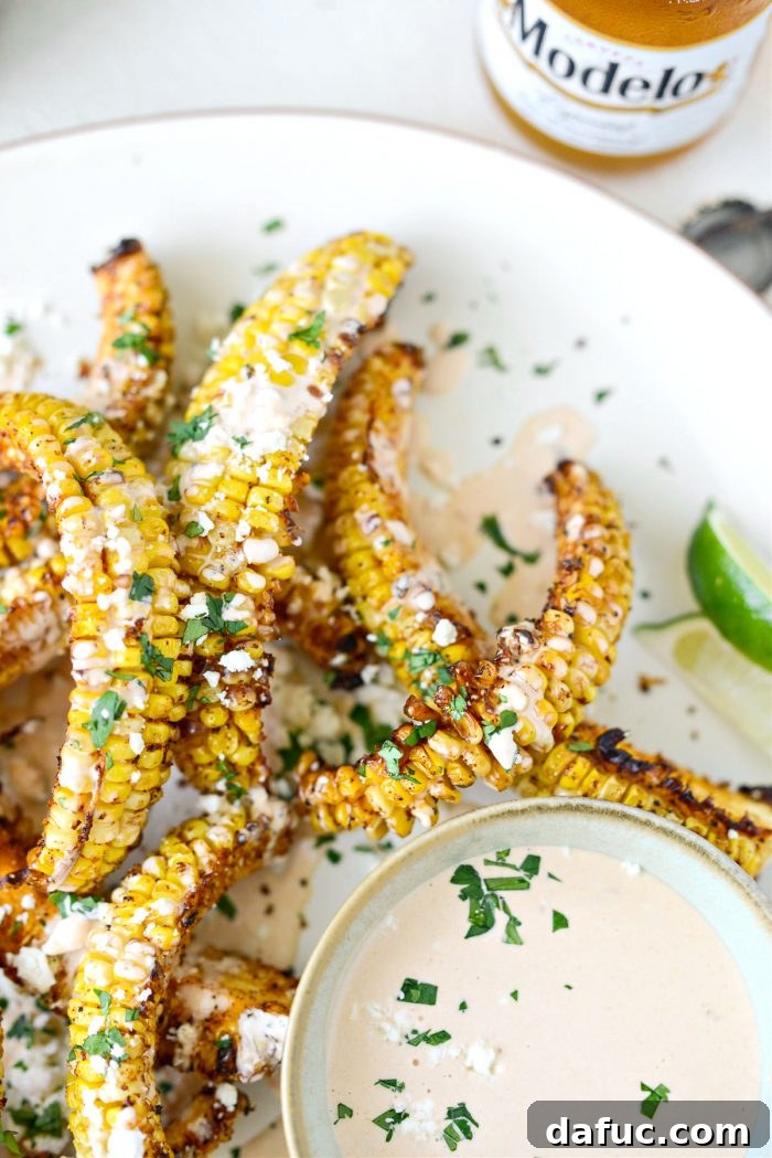 Air fried corn ribs plated with dipping sauce