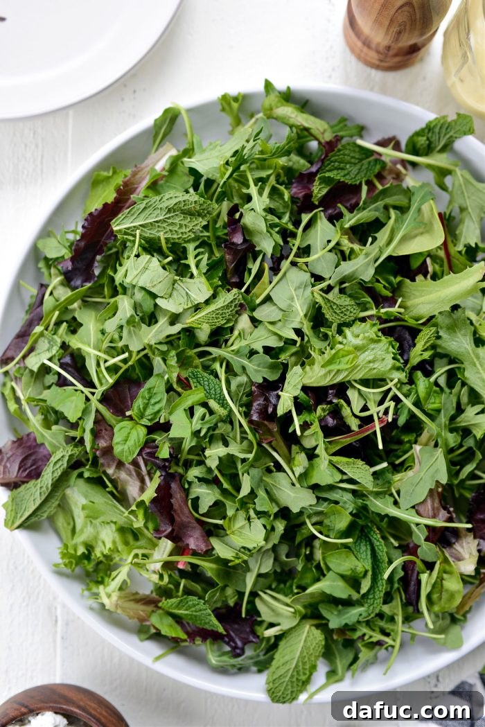 arugula, spring greens, mint and basil on platter