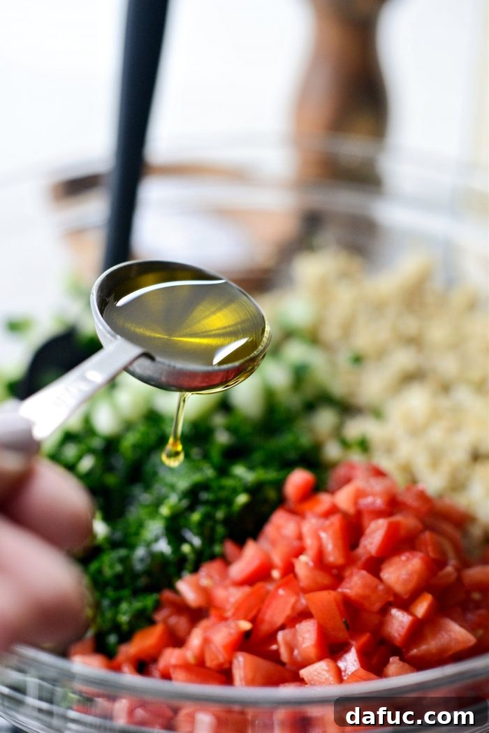 Golden Roasted Cauliflower Tabbouleh 12 Measuring olive oil for the tabbouleh dressing