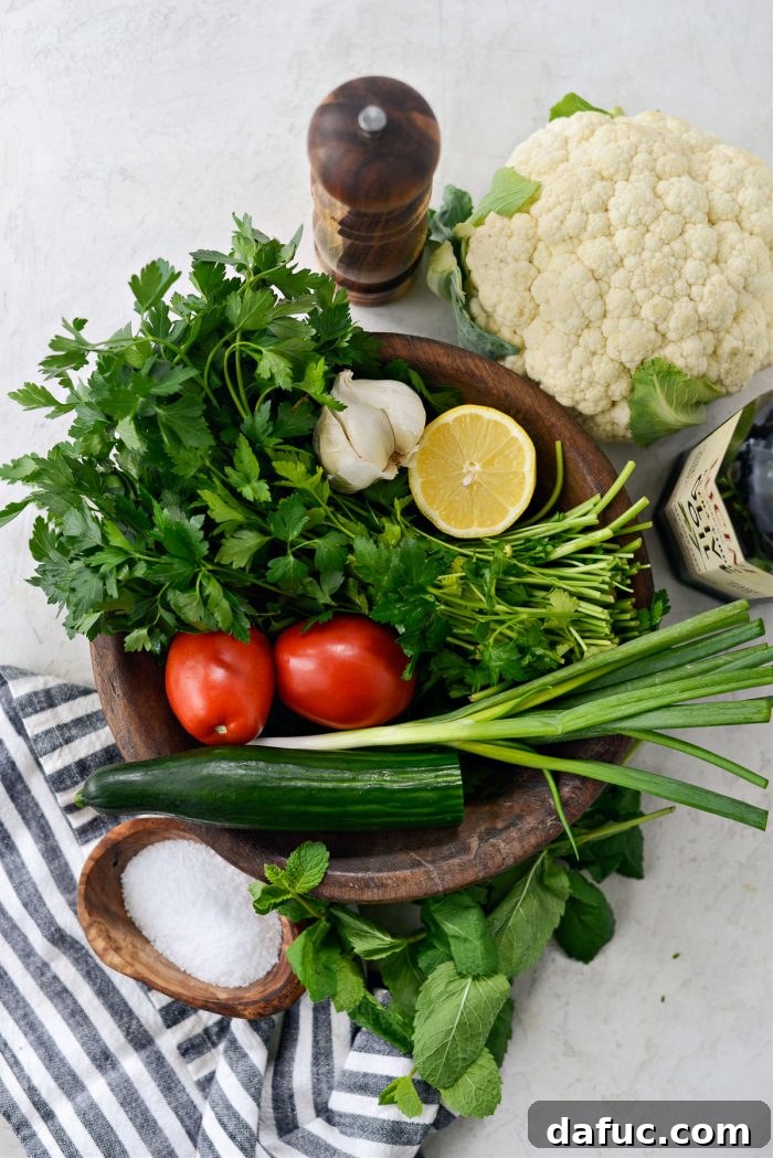 Golden Roasted Cauliflower Tabbouleh 4 Fresh ingredients for Roasted Cauliflower Tabbouleh including cauliflower, herbs, tomatoes, and cucumber